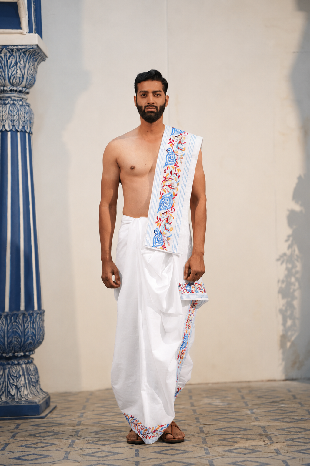 Man wearing a shankh design border white cotton dhoti with uparana