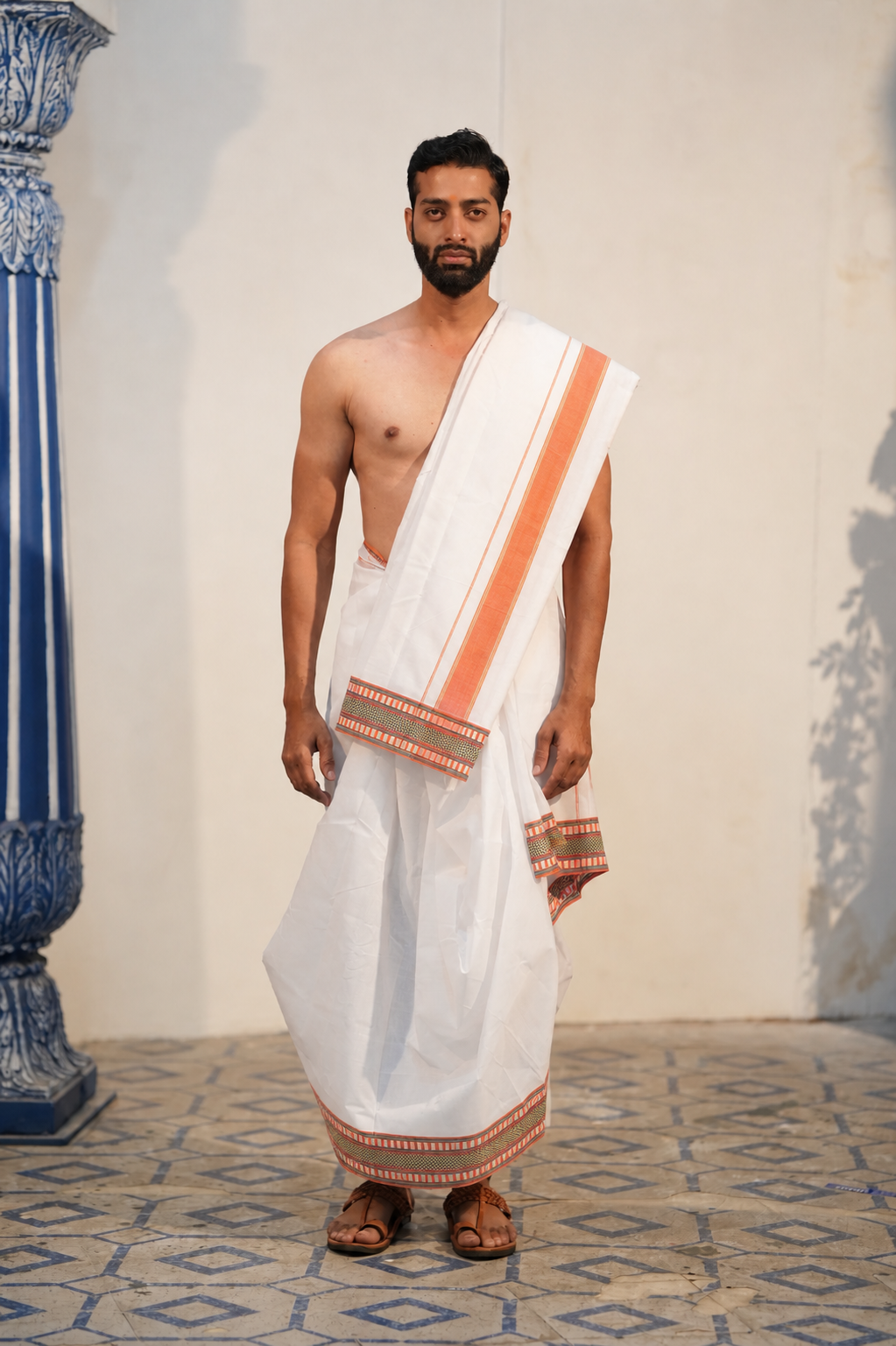 Man wearing a aesthetic orange border white cotton dhoti with uparana