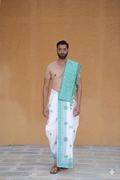A man wearing classic aqua green bordered white pure cotton dhoti with gamchha