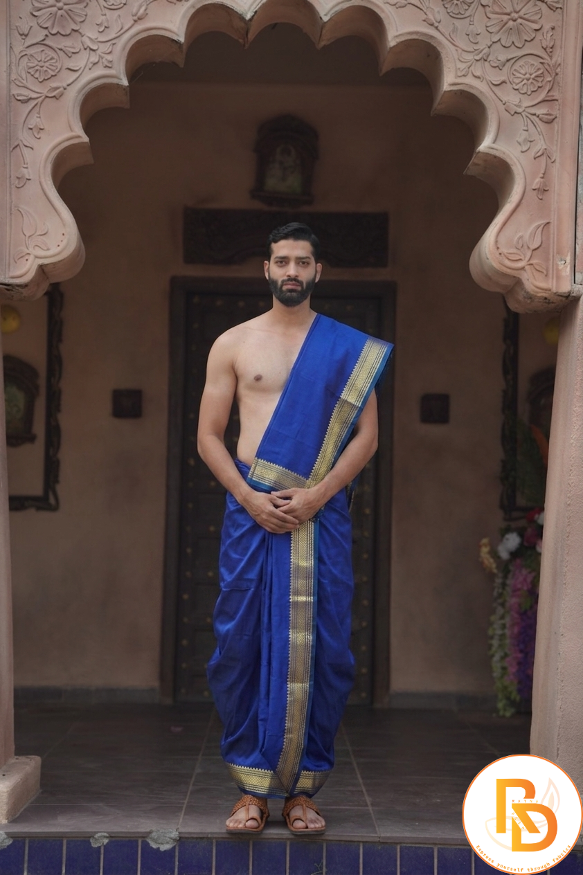 Man wearing a blue silk kasab border dhoti with uparana