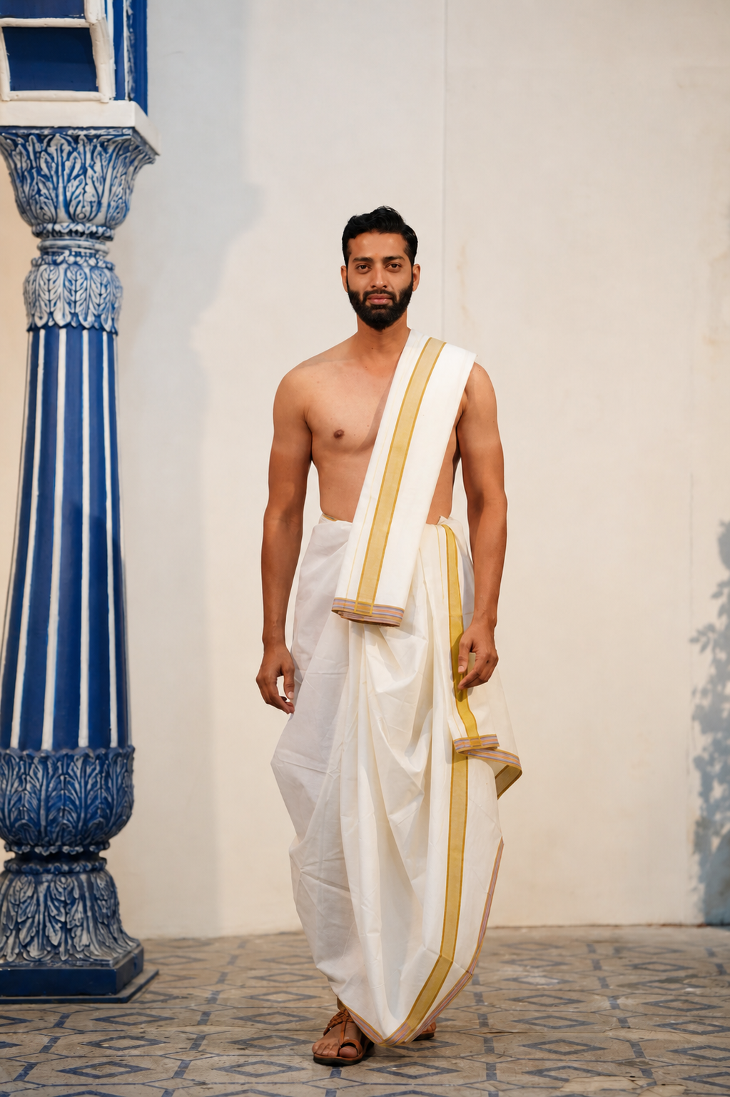 Man wearing a brown border white cotton dhoti with khes