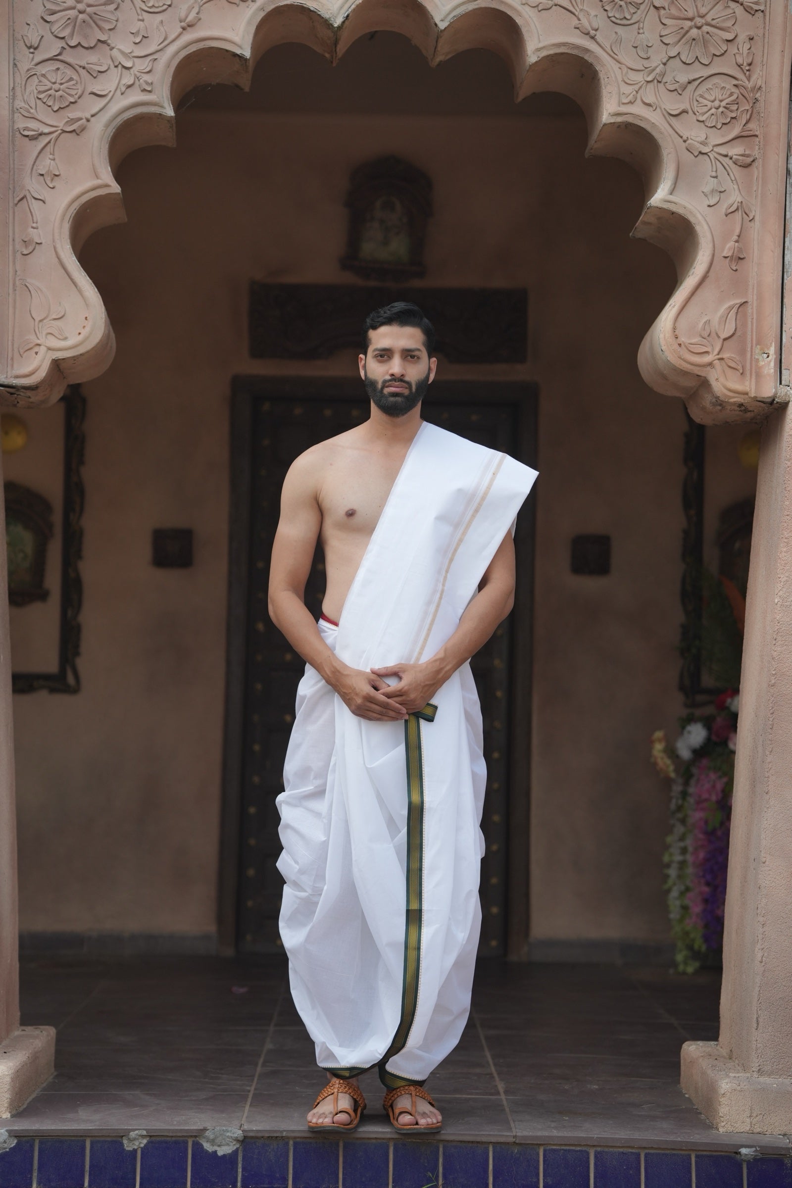 Man wearing dual tone ganga jamuna border white cotton dhoti with khes