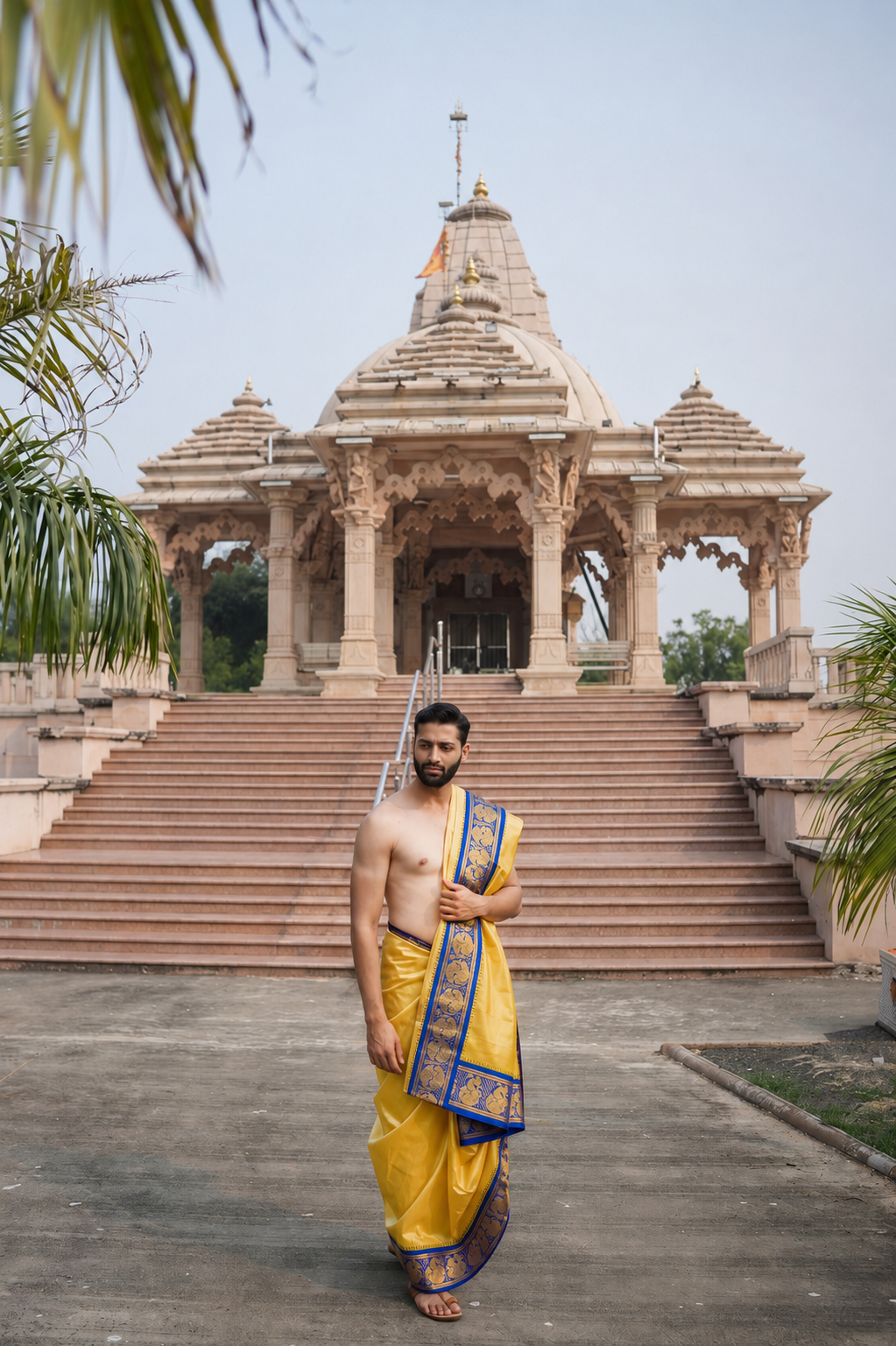 Man wearing a dual zari border premium yellow dhoti with uparana