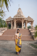 Man wearing a dual zari border premium yellow dhoti with uparana