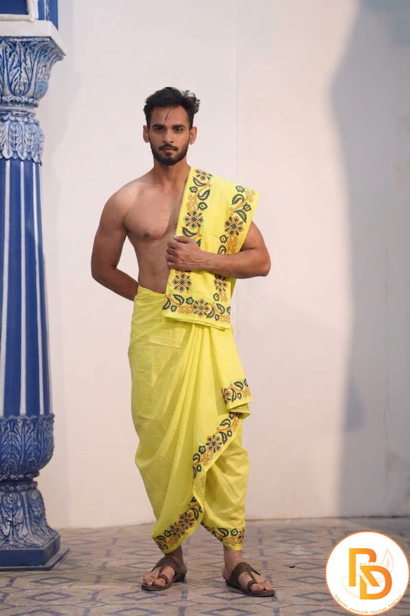 Man wearing a floral printed yellow cotton dhoti with gamcha