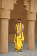 Man wearing a flower design border yellow cotton dhoti with uparana