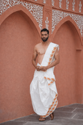 Man wearing a flute design border cotton dhoti with uparana