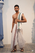Man wearing a forest green stripe & multicolour border white cotton dhoti with uparana