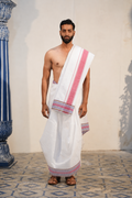 Man wearing a geometric multicolour border white pure cotton dhoti with khes