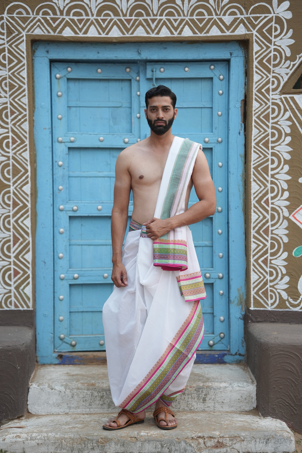 Man wearing a geometric tile border white pure cotton dhoti with uparana