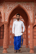 Man wearing a golden border blue dhoti and shirt combo