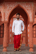 Man wearing a golden border red dhoti and shirt combo