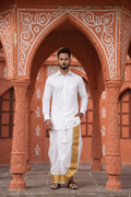 Man wearing a golden border white dhoti and shirt combo