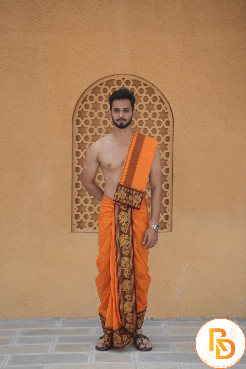 Man wearing a golden elephant design maroon border orange dhoti with uparana