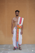 Man wearing a golden elephant jacquard border cotton dhoti with khes