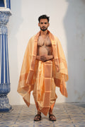 Man wearing golden emboss silk dhoti with matching uparana