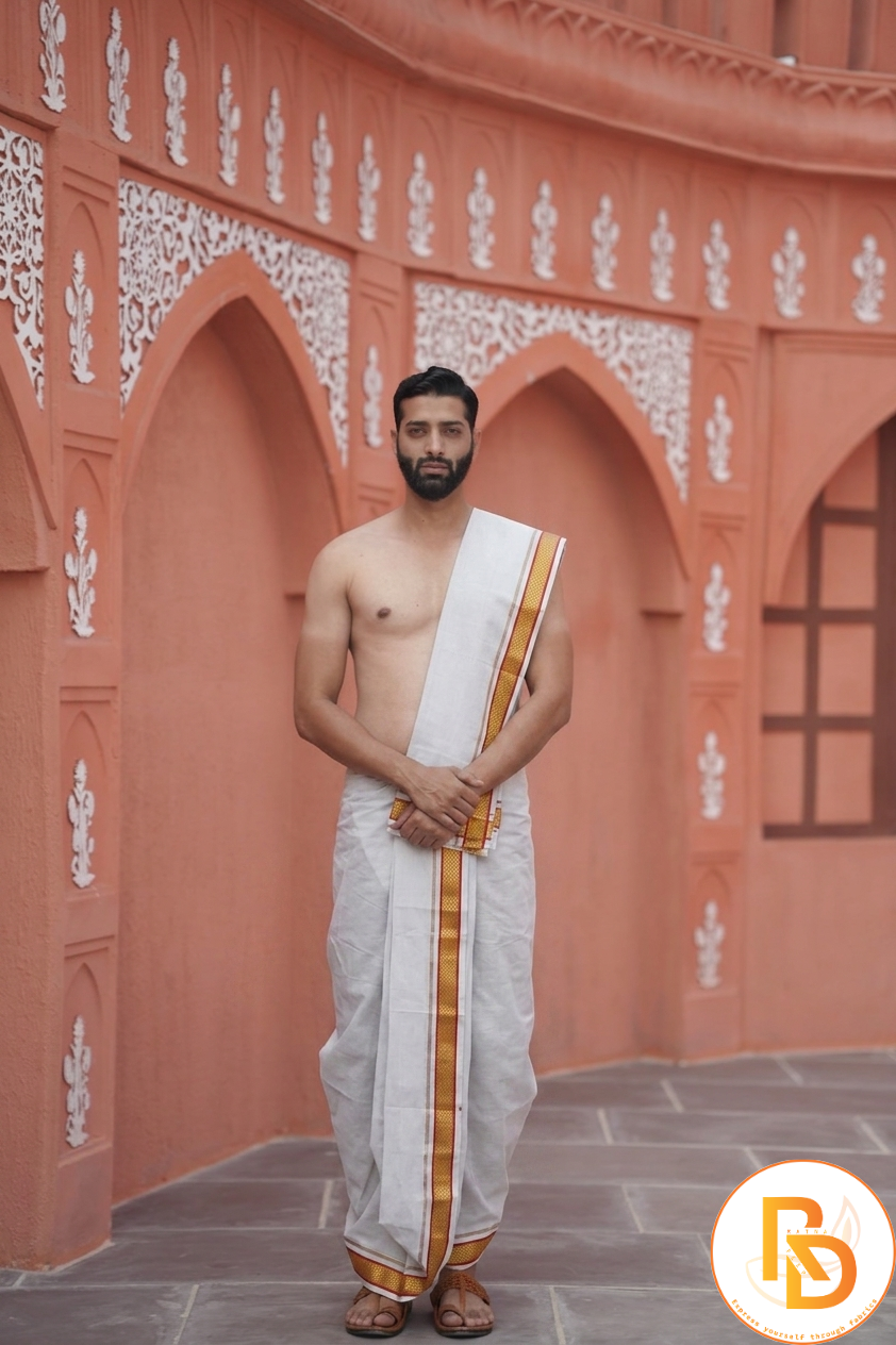 Man wearing a golden temple border cotton dhoti with khes