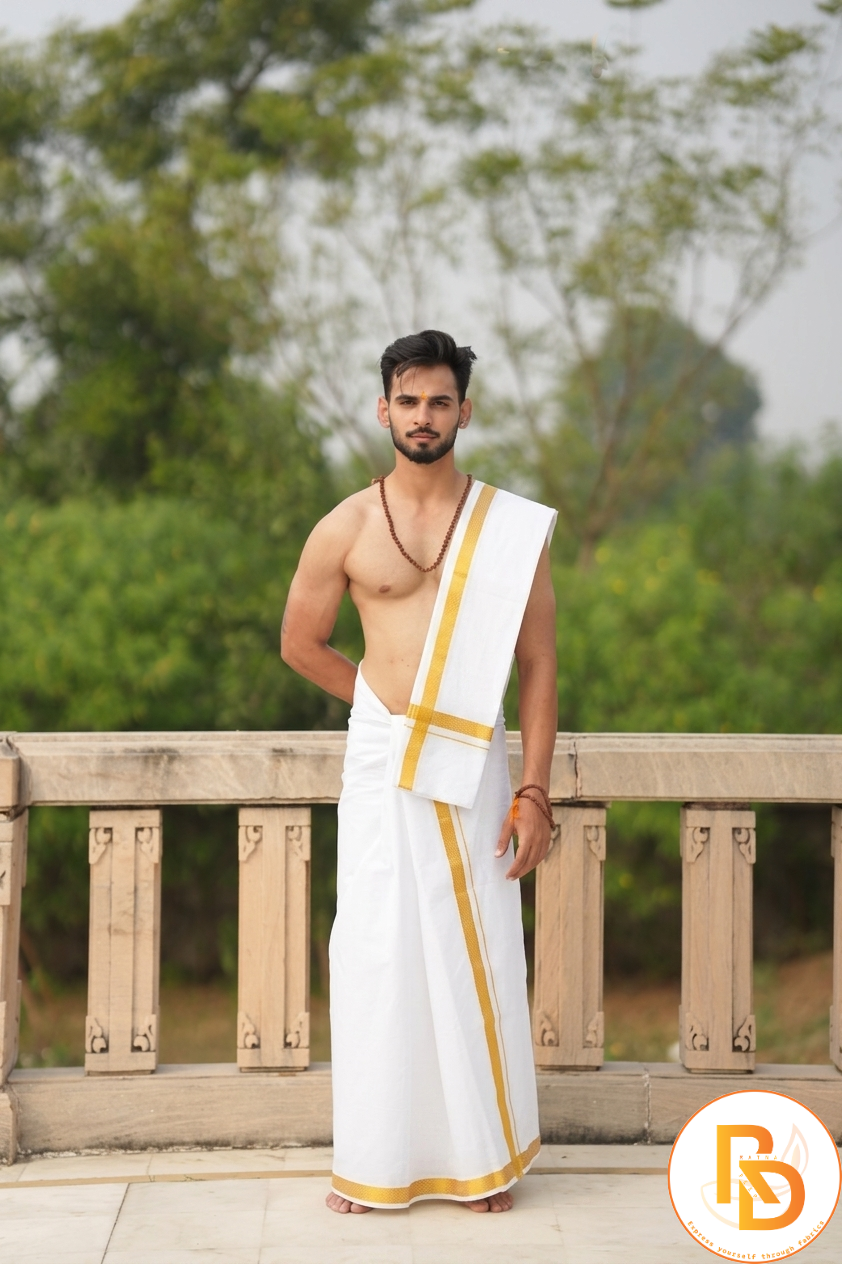 Man wearing a golden zari border cotton dhoti with khes
