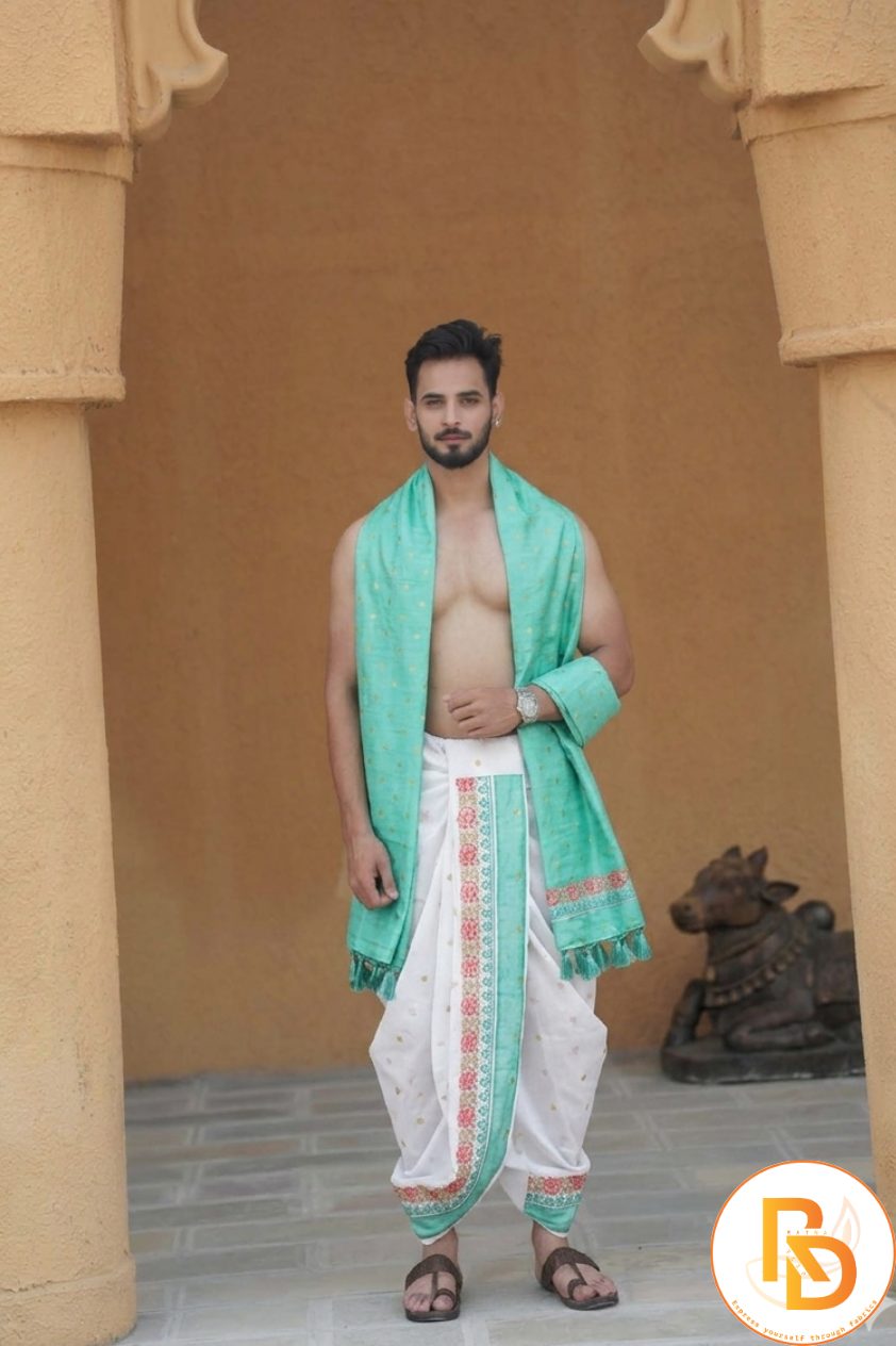 Man wearing a green border abhishek dhoti with matching gamcha