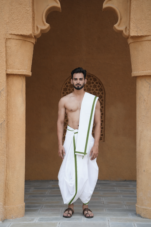 Man wearing a green stripe border cotton dhoti with matching khes