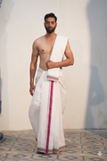 Man wearing a hot pink border pure cotton dhoti with uparana