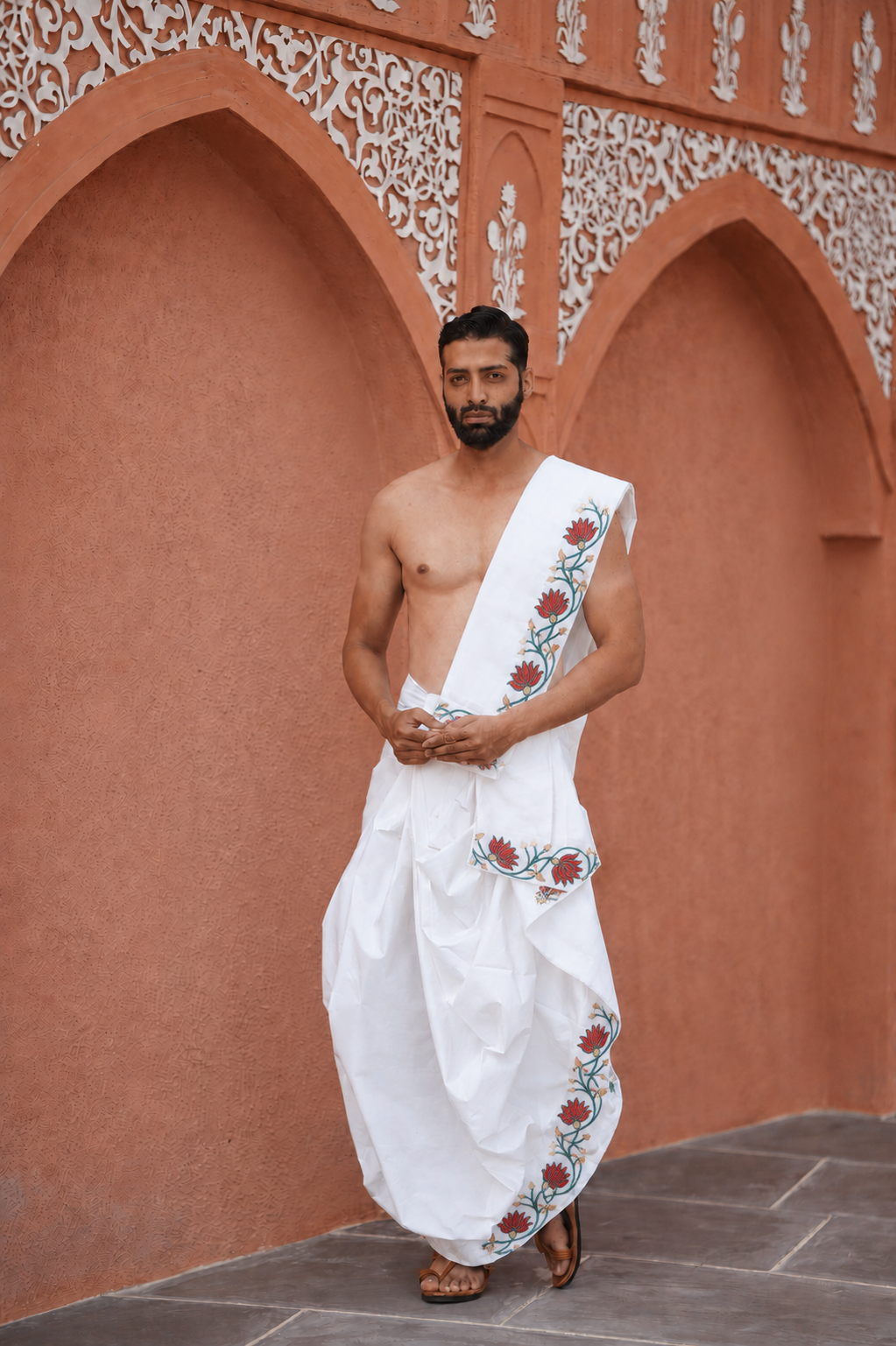Man wearing a lotus border organic cotton dhoti with khes