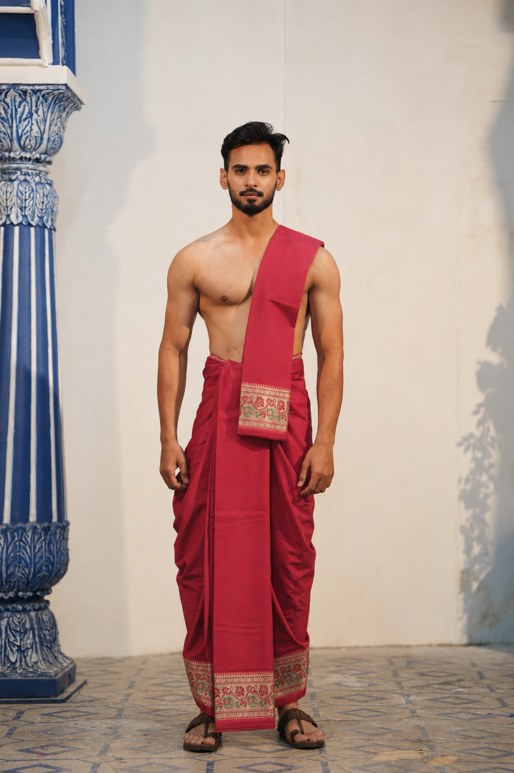 Man wearing a maroon floral border semi silk dhoti with uparana