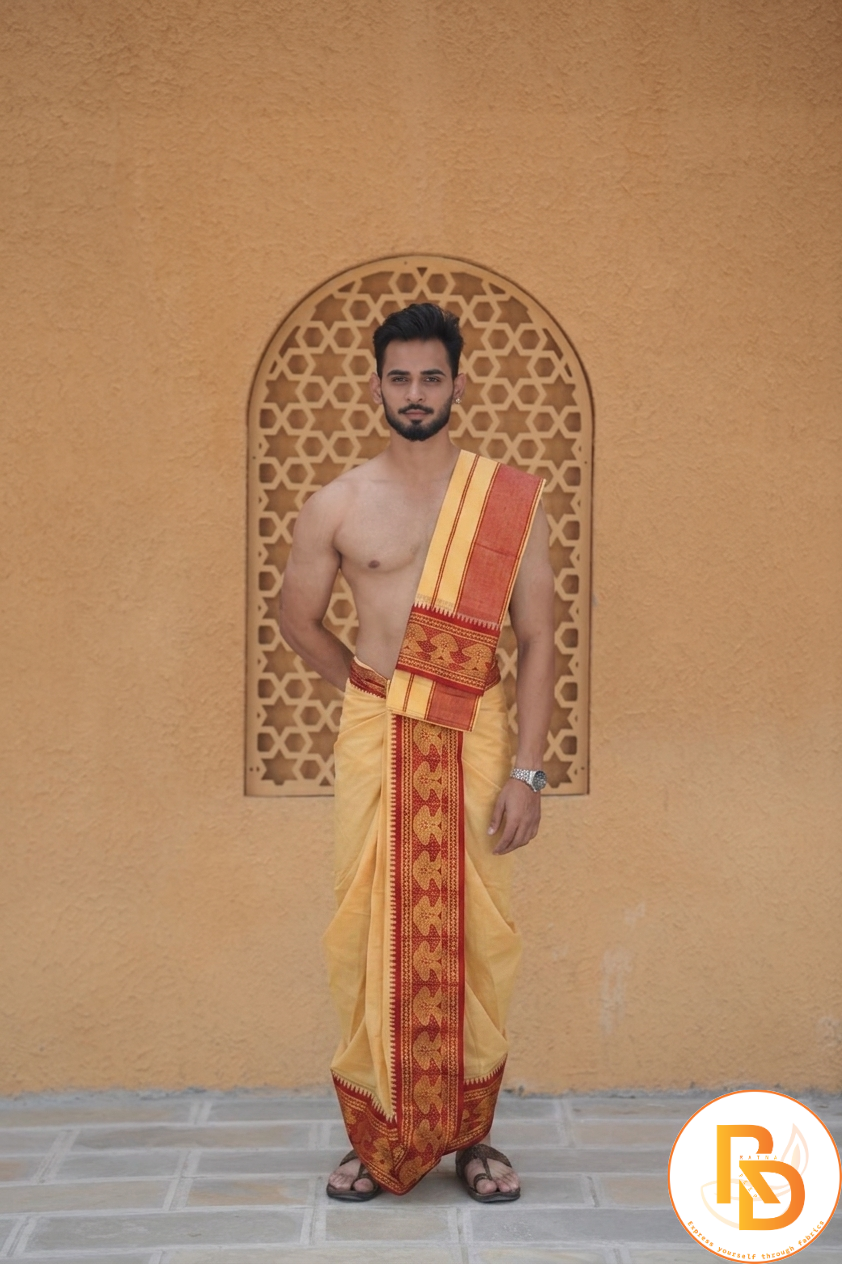 Man wearing a maroon jacquard temple border yellow dhoti with khes