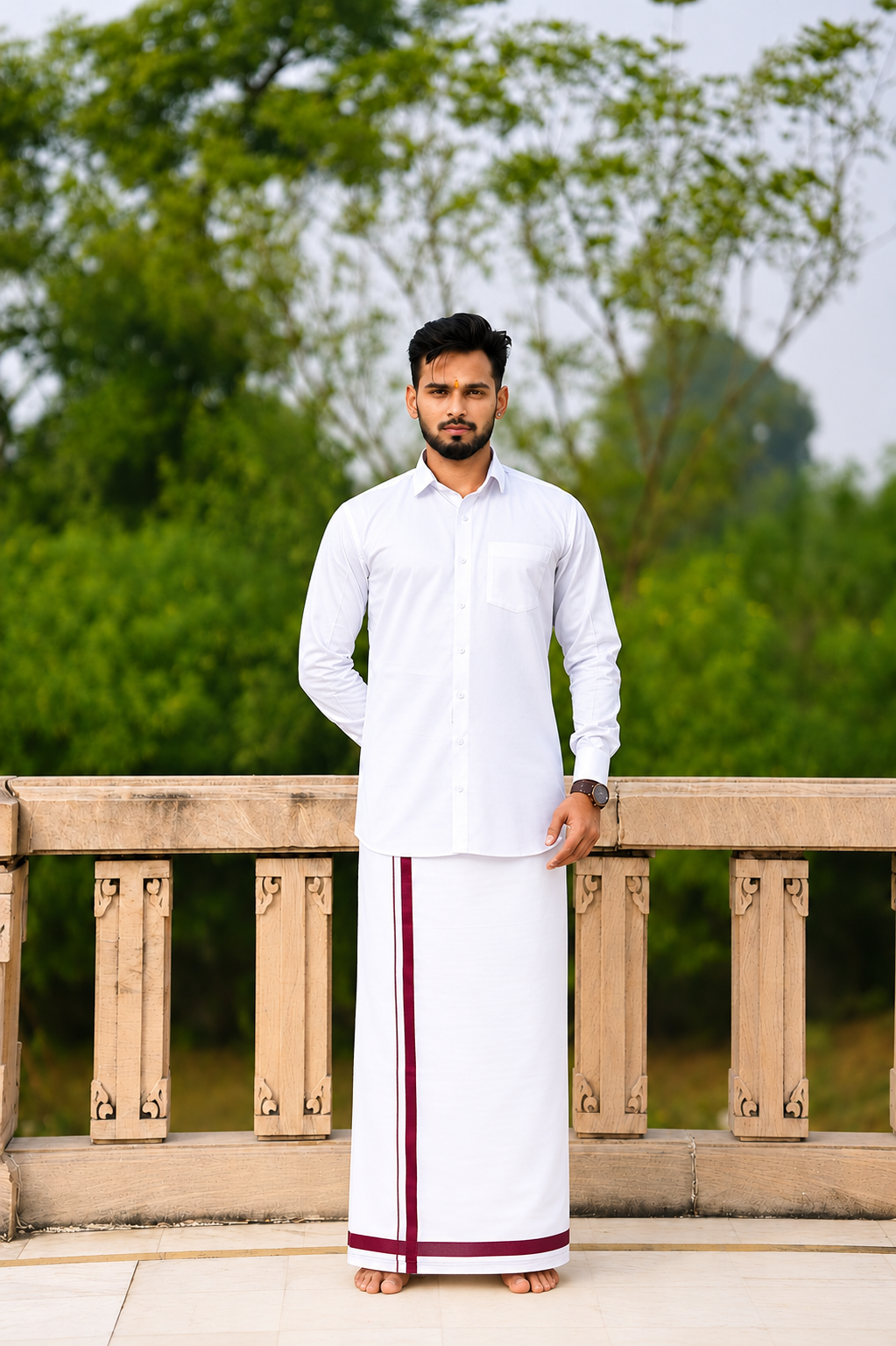 Man wearing a maroon stripe border white dhoti and shirt combo