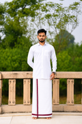 Man wearing a maroon stripe border white dhoti and shirt combo