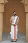 Man wearing a multicolor aattern border cotton dhoti with uparana