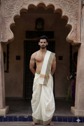 Man wearing a multicolour checks border white cotton dhoti with matching uparana