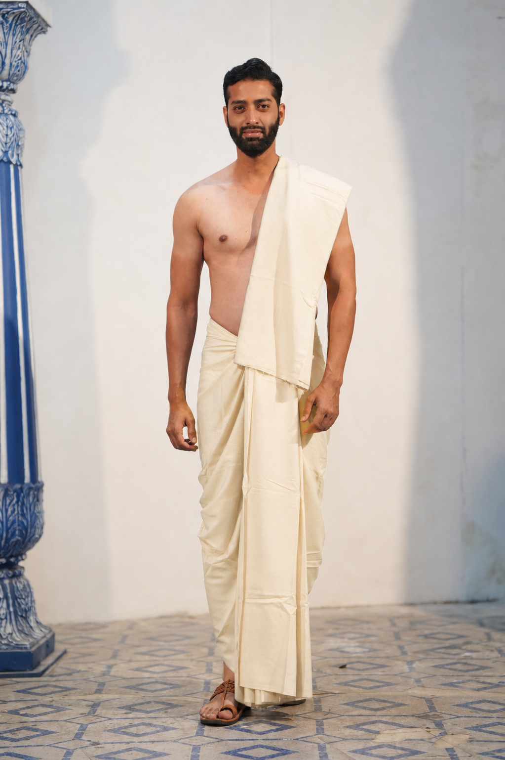 Man wearing a off white plain cotton dhoti with khes 