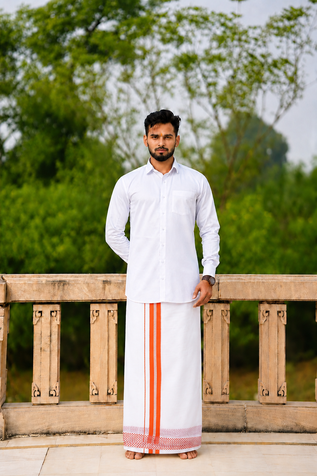 Man wearing a orange border white dhoti and shirt combo