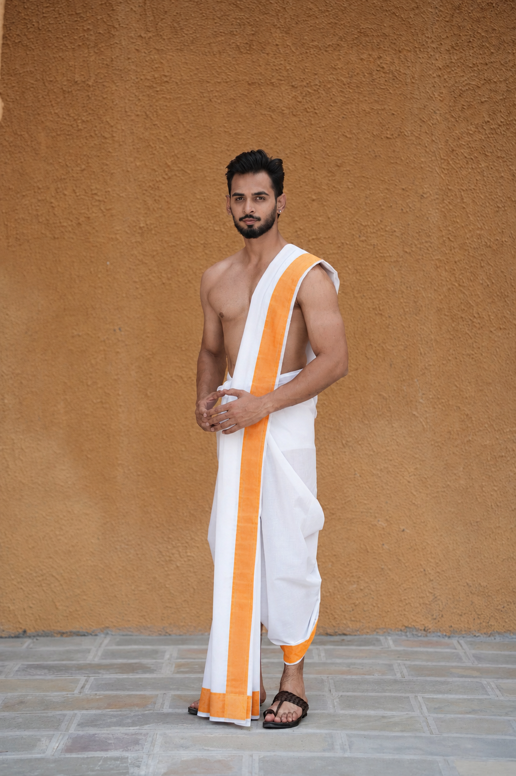 Man wearing orange color border cotton dhoti with uparana