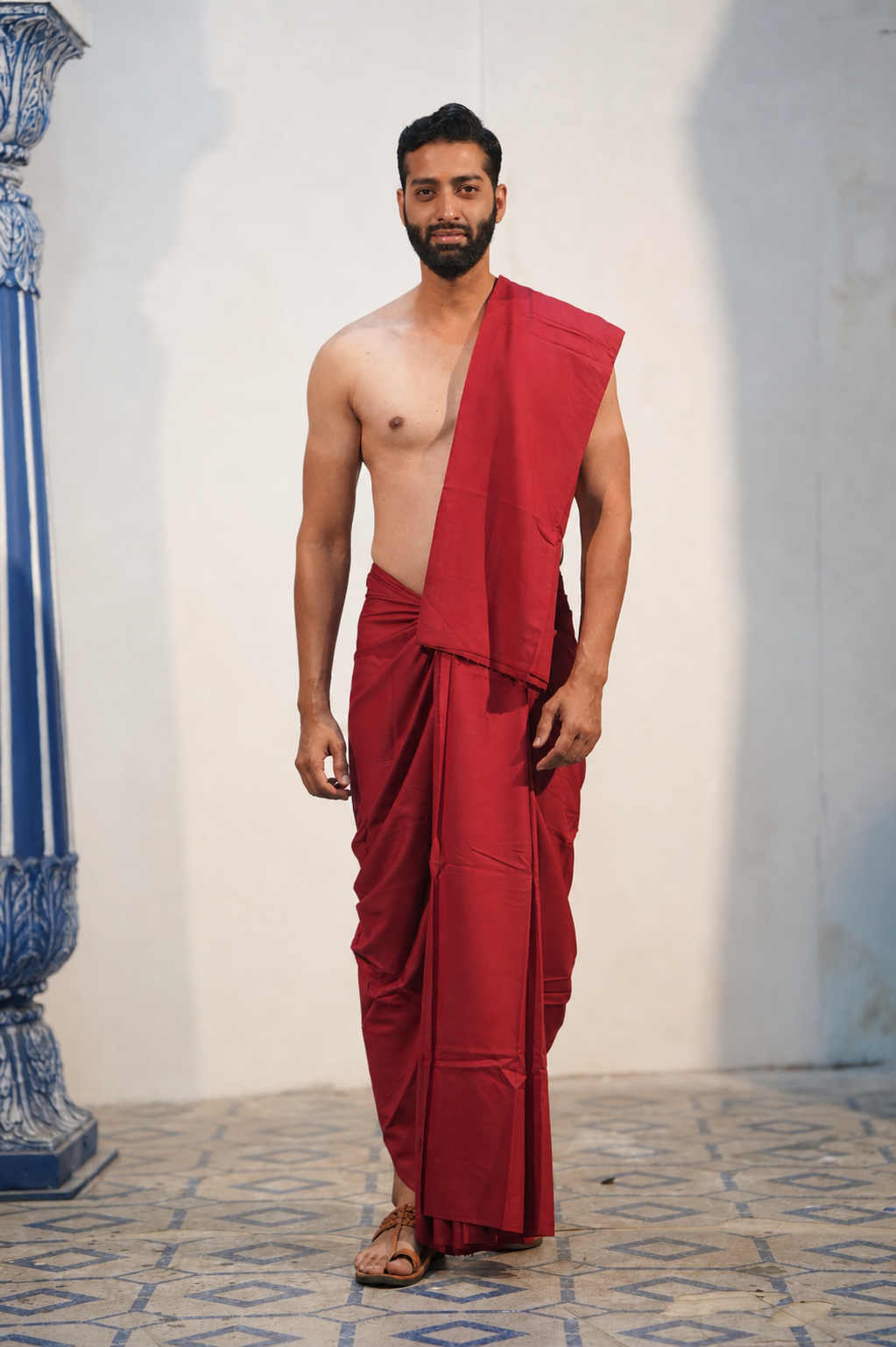 Man wearing a plain maroon cotton dhoti with matching khes