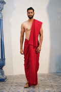 Man wearing a plain red cotton dhoti with matching khes