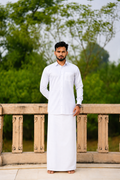 Man wearing a plain white dhoti and white shirt combo