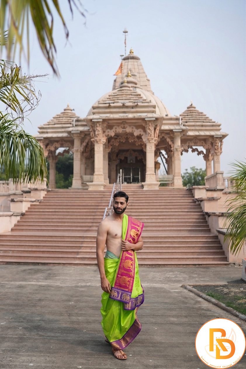 Man wearing a rajawadi luxe elephant border parrot green dhoti with uparana 