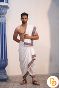 Man wearing a red and green floral border white cotton dhoti with gamcha