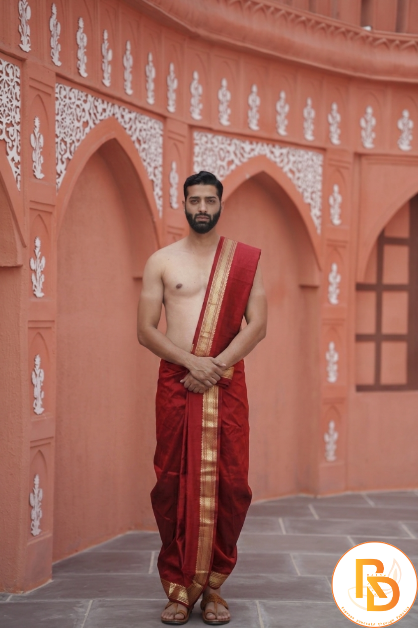 Man wearing a red silk kasab border arificial silk dhoti with uparana