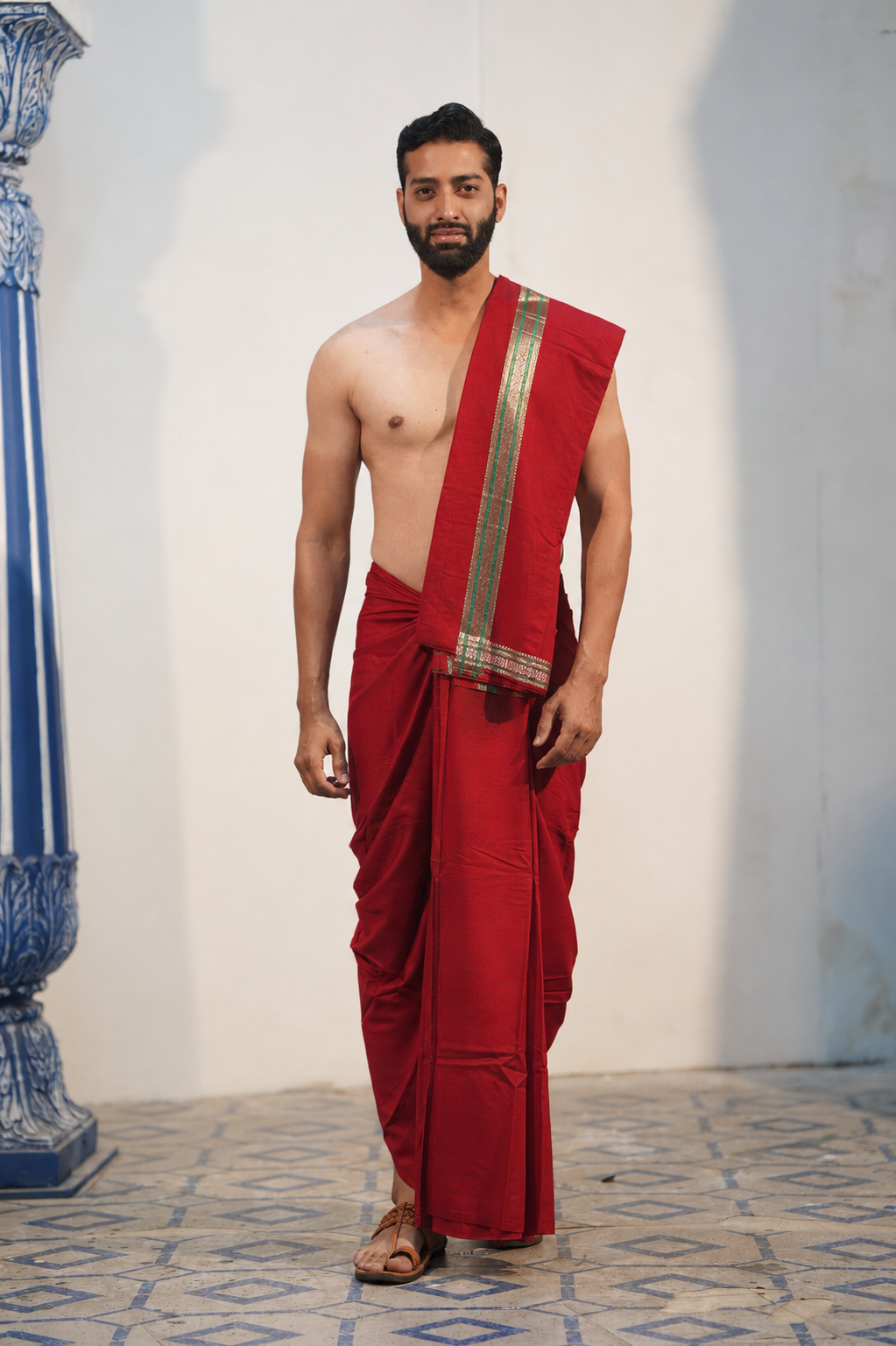 Man wearing a rudraksh border red dhoti with khes