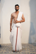 Man wearing a saptgiri handwoven border white cotton dhoti with uparana