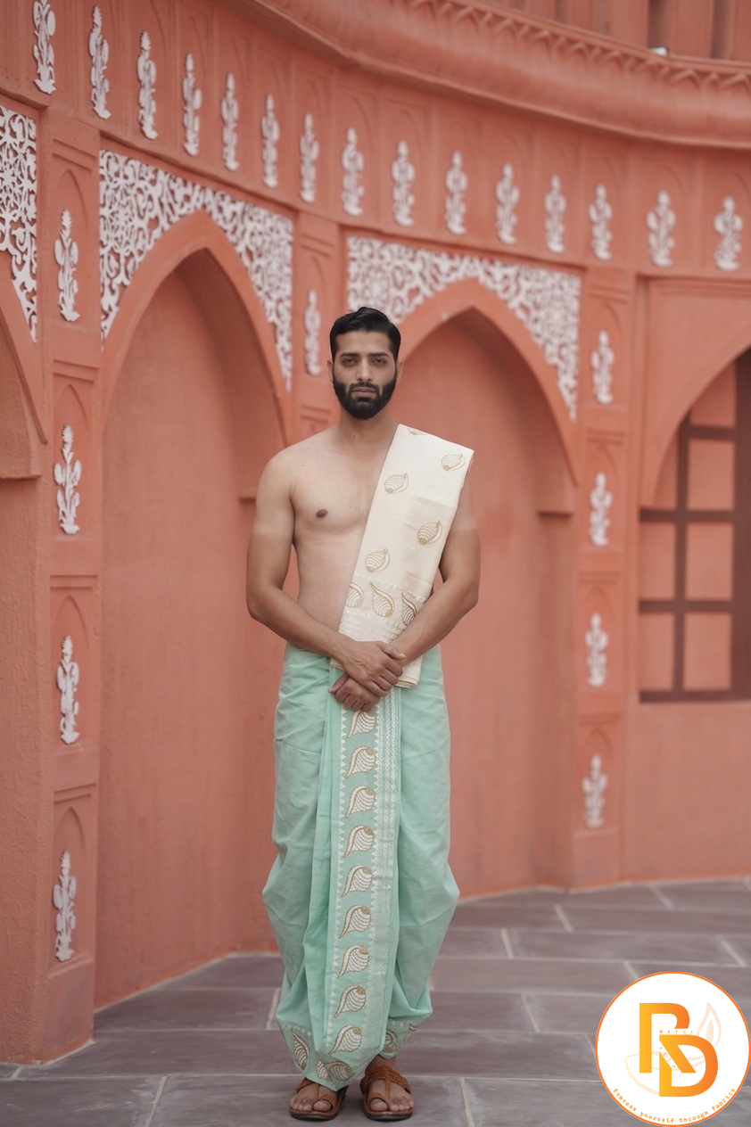 Man wearing a shankh design border pista green dhoti with uparana