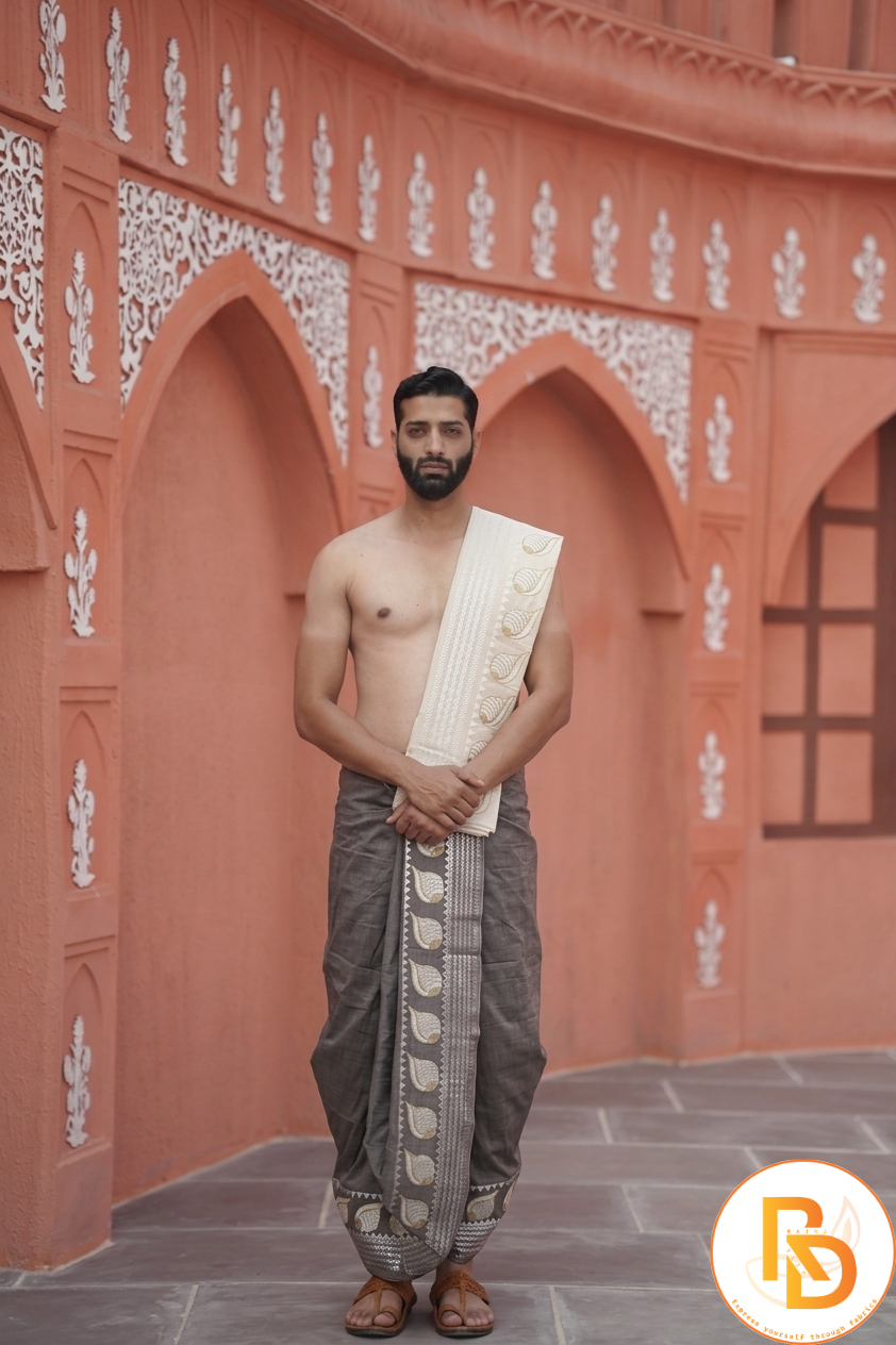 Man wearing a shell design border brown dhoti with khes