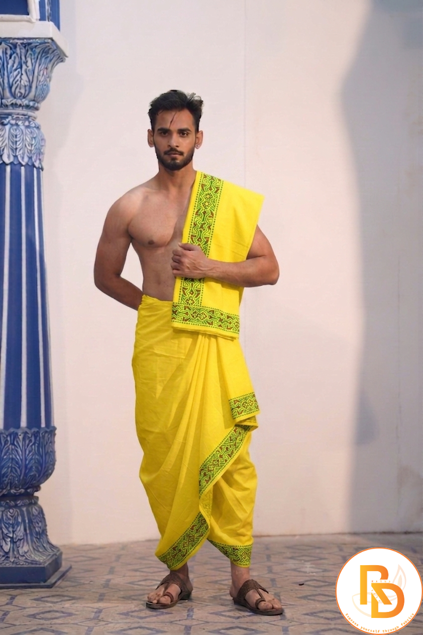 Man wearing a stylish green designing border yellow cotton dhoti with uparana