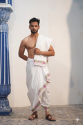 Man wearing a stylish pink & green floral border white pure cotton dhoti with matching uparana