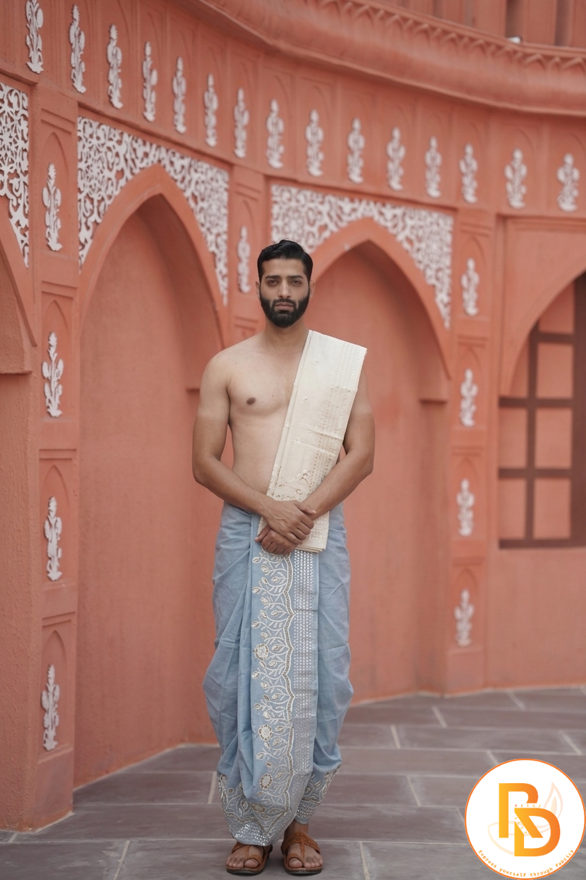 Man wearing a sunflower design border dhoti with khes