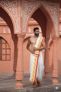 Man wearing a thilani motif print cotton dhoti with uparana