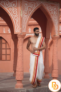 Man wearing a thilani motif printed red border cotton dhoti with uparana